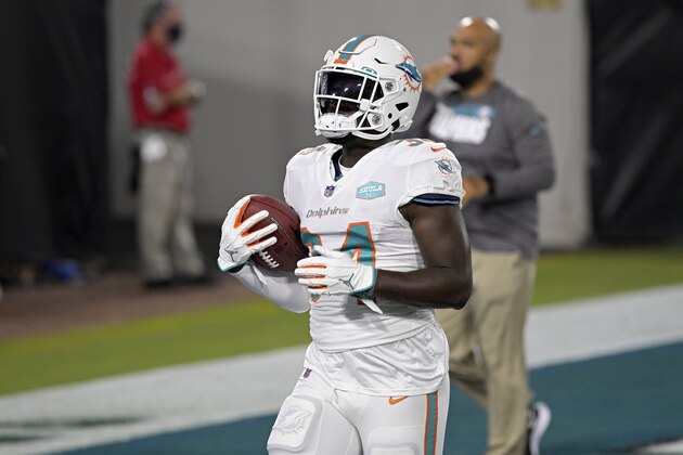 Miami Dolphins running back Jordan Howard (34) warms up before an NFL football game against the Jacksonville Jaguars, Thursday, Sept. 24, 2020, in Jacksonville, Fla. (AP Photo/Phelan M. Ebenhack)