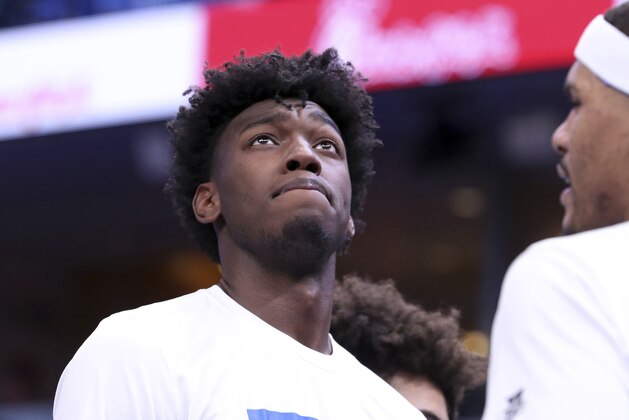 FILE - In this Tuesday, Dec. 3, 2019, file photo, Memphis' James Wiseman pauses during a timeout in the second half of an NCAA college basketball game against Bradley, in Memphis, Tenn. Wiseman is the headliner of the big men in the NBA draft on Wednesday, Nov. 18, 2020, and is expected to go in the top three picks. (AP Photo/Karen Pulfer Focht, File)