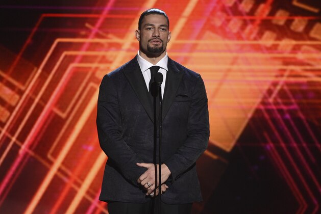 Roman Reigns presents the best coach award at the ESPY Awards on Wednesday, July 10, 2019, at the Microsoft Theater in Los Angeles. (Photo by Chris Pizzello/Invision/AP)
