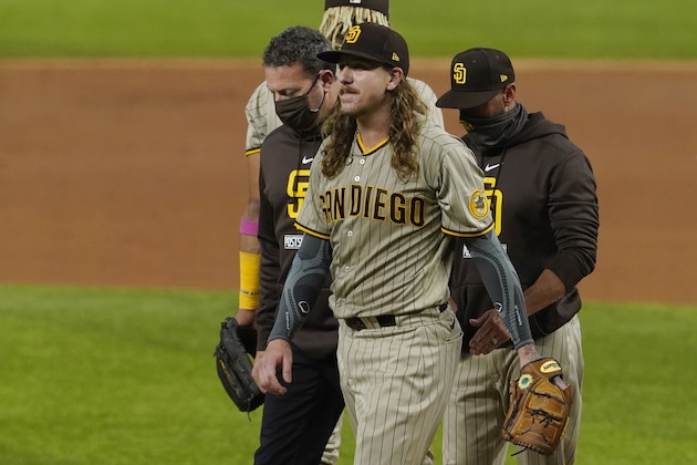 San Diego Padres starting pitcher Mike Clevinger leaves the game with an injury during the second inning in Game 1 of a baseball NL Division Series against the Los Angeles Dodgers, Tuesday, Oct. 6, 2020, in Arlington, Texas. (AP Photo/Tony Gutierrez)