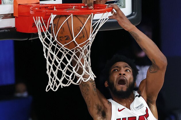 Miami Heat's Derrick Jones Jr. dunks against the Oklahoma City Thunder during the second half of an NBA basketball game Wednesday, Aug. 12, 2020, in Lake Buena Vista, Fla. (Kevin C. Cox/Pool Photo via AP)