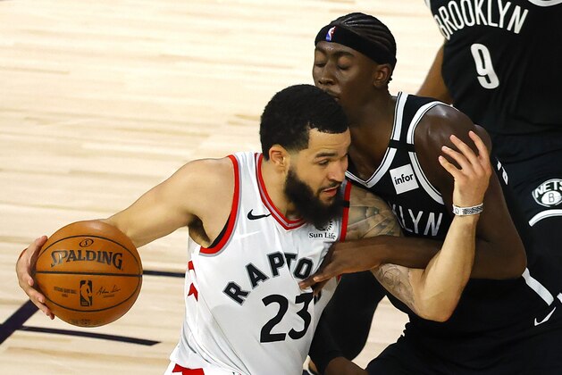 Fred VanVleet (23) of the Toronto Raptors drives against Caris LeVert of the Brooklyn Nets during the fourth quarter of Game 2 of an NBA basketball first-round playoff series, Wednesday, Aug. 19, 2020, in Lake Buena Vista, Fla. (Kevin C. Cox/Pool Photo via AP)