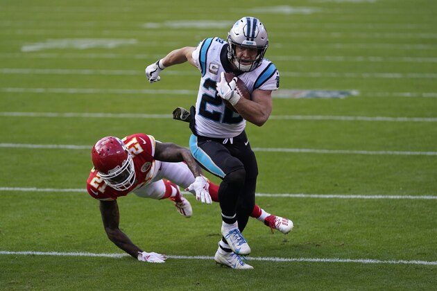 Carolina Panthers running back Christian McCaffrey (22) runs against Kansas City Chiefs cornerback Bashaud Breeland (21) during the second half of an NFL football game in Kansas City, Mo., Sunday, Nov. 8, 2020. (AP Photo/Jeff Roberson)