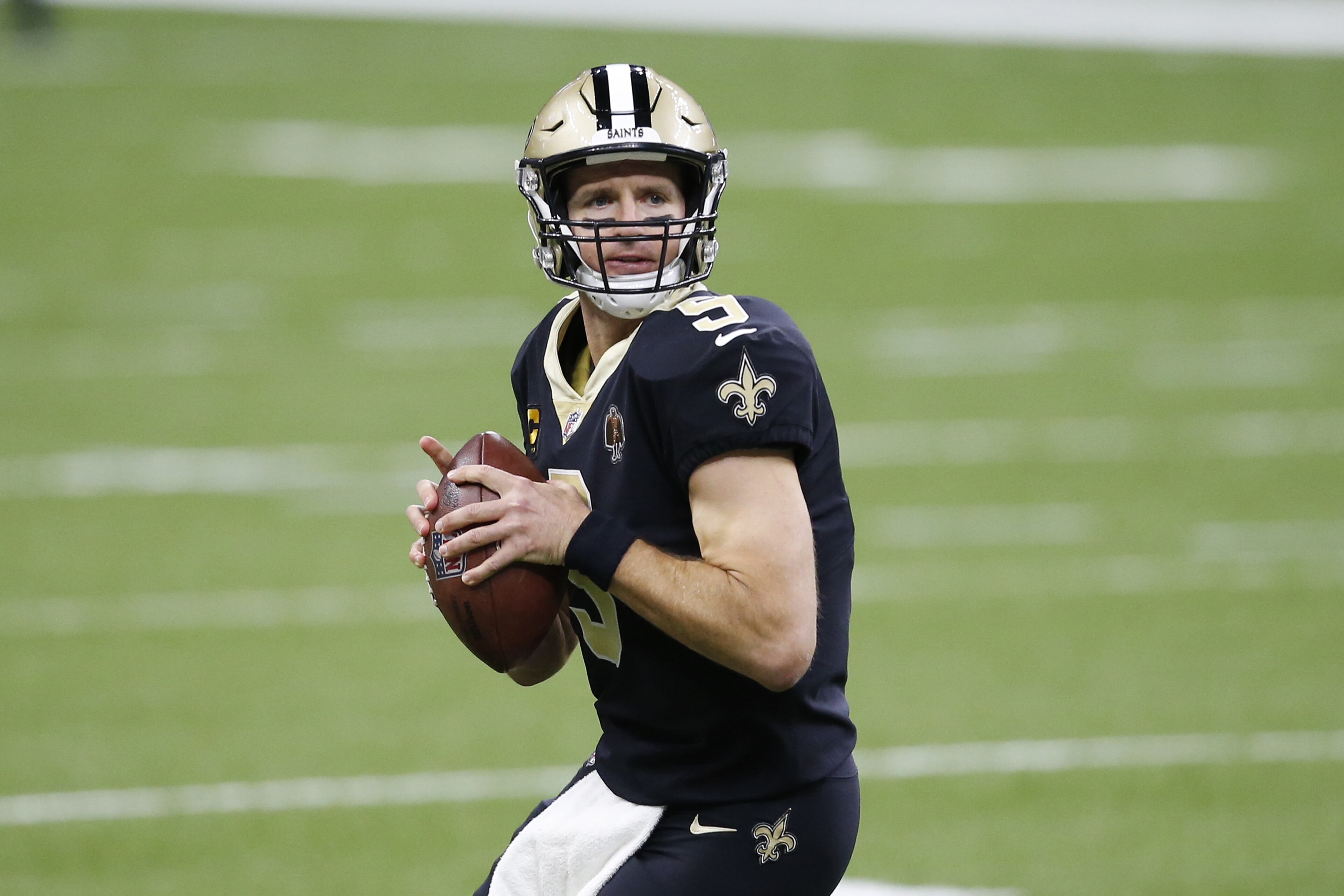 New Orleans Saints quarterback Drew Brees (9) warms up before an NFL football game against the San Francisco 49ers in New Orleans, Sunday, Nov. 15, 2020. (AP Photo/Butch Dill)