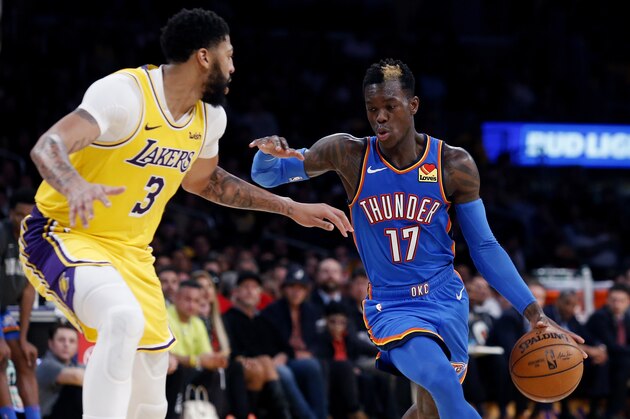 Oklahoma City Thunder's Dennis Schroeder (17) drives against Los Angeles Lakers' Anthony Davis (3) during the second half of an NBA basketball game Tuesday, Nov. 19, 2019, in Los Angeles. The Lakers won 112-107. (AP Photo/Ringo H.W. Chiu)