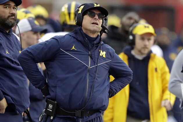 Michigan head coach Jim Harbaugh watches a replay during the first half of an NCAA college football game against Indiana, Saturday, Nov. 23, 2019, in Bloomington, Ind. (AP Photo/Darron Cummings)