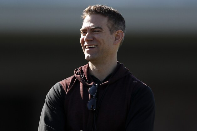 Chicago Cubs president of baseball operations Theo Epstein looks on during a spring training baseball workout Wednesday, Feb. 12, 2020, in Mesa, Ariz. (AP Photo/Gregory Bull)