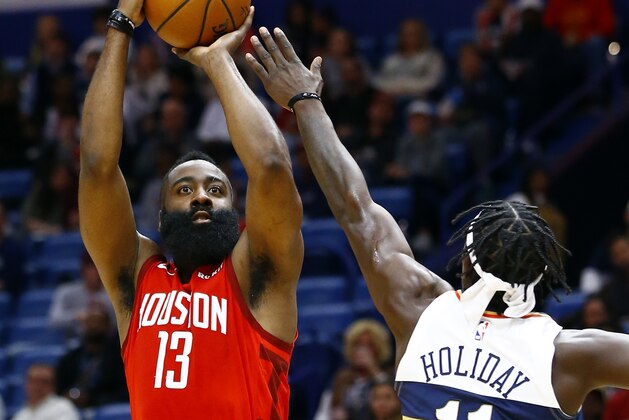 Houston Rockets guard James Harden (13)  shoots over New Orleans Pelicans guard Jrue Holiday (11) during the first half of an NBA basketball game, Saturday, Dec. 29, 2018, in New Orleans. (AP Photo/Butch Dill)