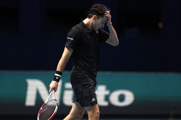 Dominic Thiem of Austria reacts after winning his singles tennis match against Rafael Nadal of Spain at the ATP World Finals tennis tournament at the O2 arena in London, Tuesday, Nov. 17, 2020. (AP Photo/Frank Augstein)