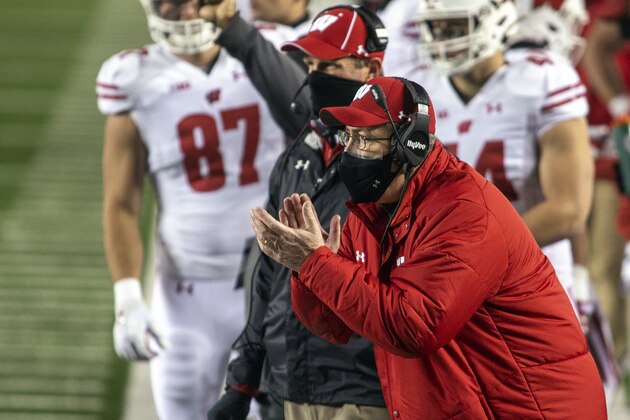 Wisconsin coach Paul Chryst cheers on his players from the sideline during the first quarter of the team's NCAA college football game against Michigan in Ann Arbor, Mich., Saturday, Nov. 14, 2020. (AP Photo/Tony Ding)