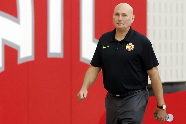 Atlanta Hawks general manager and head of basketball operations Travis Schlenk prepares to speak to reporters after it was announced the team and head basketball coach Mike Budenholzer have decided to part ways Thursday, April 26, 2018, in Atlanta. (AP Photo/John Bazemore)