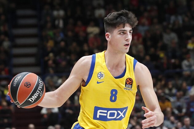 FILE - In this Nov. 19 2019 file photo, Maccabi Fox Tel Aviv's Deni Avdija controls the ball during the Euro League basketball match between Olimpia Milan and Maccabi Fox Tel Aviv, in Milan, Italy.  Avdija is a potential lottery pick and one of the top forwards in next week's NBA draft(AP Photo/Antonio Calanni)
