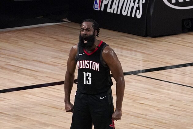 Houston Rockets' James Harden (13) celebrates after blocking a 3-point shot attempt by Oklahoma City Thunder's Luguentz Dort (5) during the second half of an NBA first-round playoff basketball game in Lake Buena Vista, Fla., Wednesday, Sept. 2, 2020. (AP Photo/Mark J. Terrill)