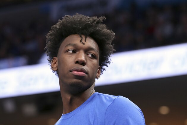 Memphis' James Wiseman watches from the bench during the first half of the team's NCAA college basketball game against Little Rock on Wednesday, Nov. 20, 2019, in Memphis, Tenn. (AP Photo/Karen Pulfer Focht)