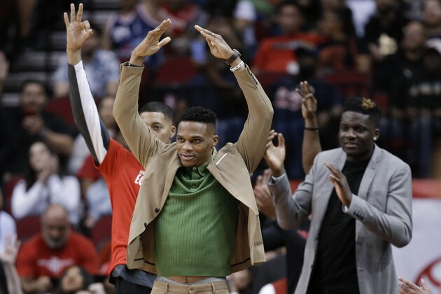 Houston Rockets guard Russell Westbrook, center, reacts after a three point basket during the second half of an NBA basketball game against the Charlotte Hornets, Tuesday, Feb. 4, 2020, in Houston. (AP Photo/Eric Christian Smith)