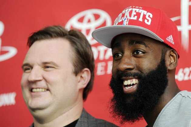 Houston Rockets general manager Daryl Morey, left, and newly acquired guard James Harden pose for photographers at an NBA basketball news conference, Monday, Oct. 29, 2012, in Houston. Morey officially introduced Harden on Monday. Harden joined Houston in a stunning trade with the Oklahoma City Thunder on Saturday night. (AP Photo/Pat Sullivan)