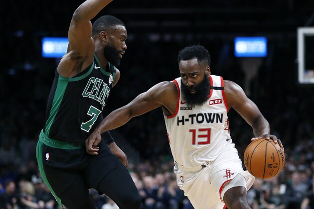 Houston Rockets' James Harden (13) drives past Boston Celtics' Jaylen Brown (7) during the first half of an NBA basketball game in Boston, Saturday, Feb. 29, 2020. (AP Photo/Michael Dwyer)
