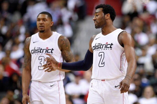 Washington Wizards guard John Wall (2) gestures in front of Bradley Beal (3) during the second half of Game 3 of an NBA basketball first-round playoff series against the Toronto Raptors, Friday, April 20, 2018, in Washington. The Wizards won 122-103. (AP Photo/Nick Wass)