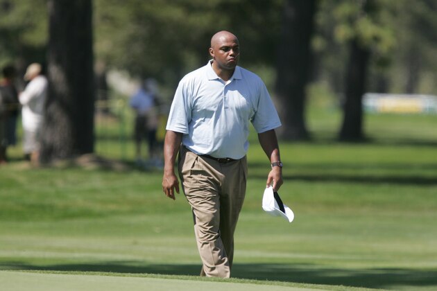 Charles Barkley walks along the 18th fairway toward the green during the American Century Golf Championship at Edgewood Tahoe Golf Course in Stateline, Nev., on Friday, July 17, 2009. (AP Photo/Brad Horn)