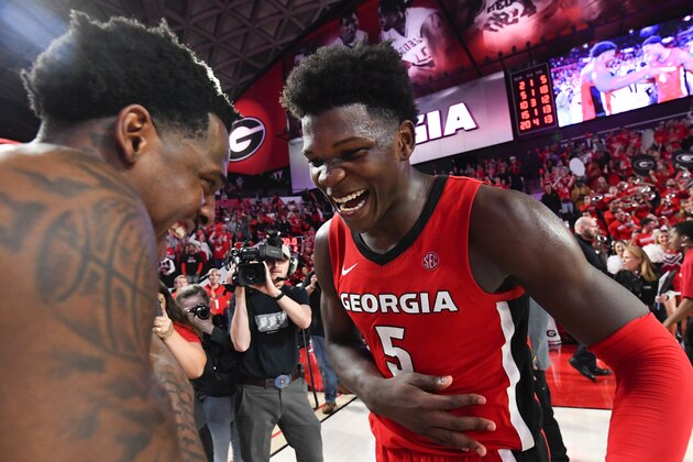 Georgia guard Anthony Edwards, right, and forward Mike Peake celebrate after an NCAA college basketball game against Auburn, Wednesday, Feb. 19, 2020, in Athens, Ga. Georgia won 65-55. (AP Photo/John Amis)