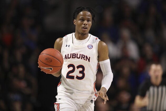 Auburn forward Isaac Okoro (23) dribbles up court against Florida during the first half of an NCAA college basketball game Saturday, Jan. 18, 2020, in Gainesville, Fla. (AP Photo/Matt Stamey)