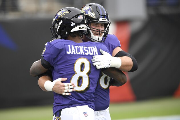 Baltimore Ravens quarterback Lamar Jackson (8) hugs center Matt Skura prior to an NFL football game against the Cincinnati Bengals, Sunday, Oct. 11, 2020, in Baltimore. (AP Photo/Nick Wass)