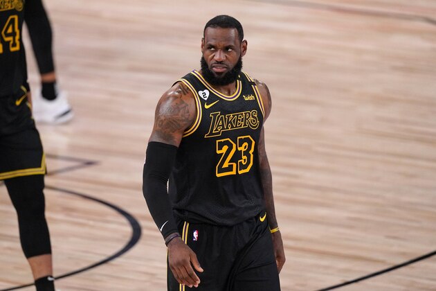 Los Angeles Lakers' LeBron James walks up court during the first half of Game 2 of basketball's NBA Finals against the Miami Heat on Friday, Oct. 2, 2020, in Lake Buena Vista, Fla. (AP Photo/Mark J. Terrill)