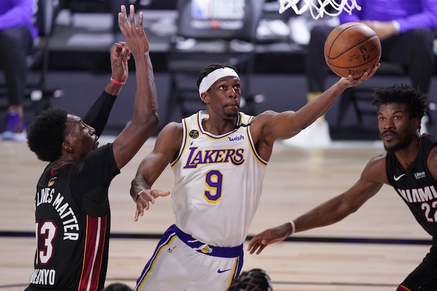 Los Angeles Lakers' Rajon Rondo (9) goes up for a shot against Miami Heat's Bam Adebayo (13) during the first half in Game 6 of basketball's NBA Finals Sunday, Oct. 11, 2020, in Lake Buena Vista, Fla. (AP Photo/Mark J. Terrill)