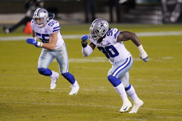 Dallas Cowboys' DeMarcus Lawrence plays during the second half of an NFL football game against the Philadelphia Eagles, Sunday, Nov. 1, 2020, in Philadelphia. (AP Photo/Chris Szagola)