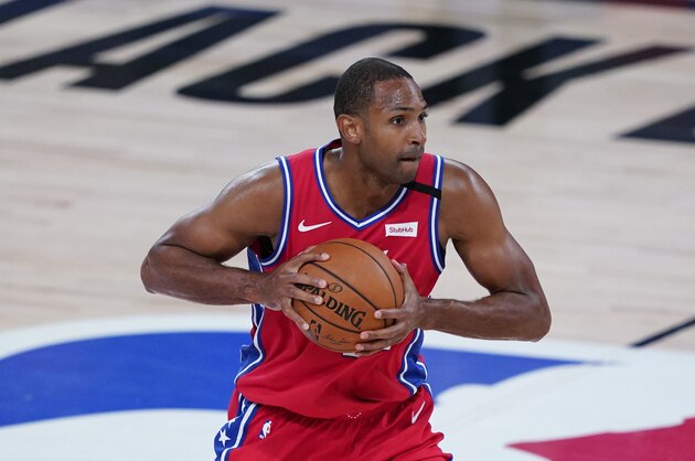 Philadelphia 76ers' Al Horford (42) makes his way down the court during an NBA basketball game against the Washington Wizards Wednesday, Aug. 5, 2020, in Lake Buena Vista, Fla. (AP Photo/Ashley Landis, Pool)
