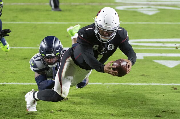 Arizona Cardinals quarterback Kyler Murray (1) dives in for a touchdown against Seattle Seahawks free safety Quandre Diggs (37) during an NFL football game, Sunday, Oct. 25, 2020, in Glendale, Ariz. The Arizona Cardinals won in overtime. (AP Photo/Jennifer Stewart)