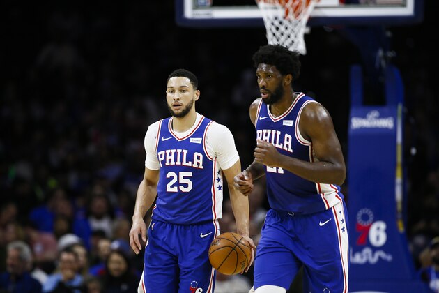 Philadelphia 76ers' Ben Simmons and Joel Embiid play during an NBA basketball game against the Cleveland Cavaliers, Tuesday, Nov. 12, 2019, in Philadelphia. (AP Photo/Matt Slocum)