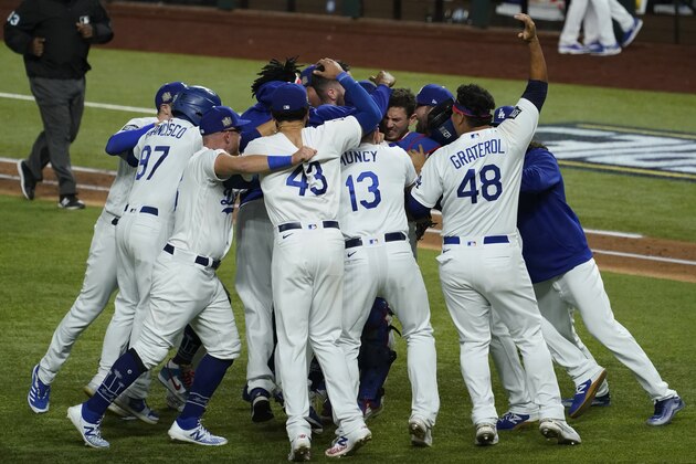 Los Angeles Dodgers celebrate after defeating the Tampa Bay Rays 3-1 to win the baseball World Series in Game 6 Tuesday, Oct. 27, 2020, in Arlington, Texas. (AP Photo/Tony Gutierrez)