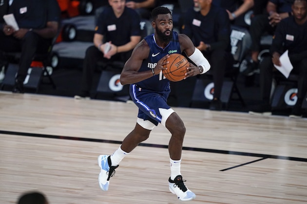 Dallas Mavericks guard Tim Hardaway Jr. (11) looks to pass against the Phoenix Suns during the first half of an NBA basketball game Sunday, Aug. 2, 2020, in Lake Buena Vista, Fla. (AP Photo/Ashley Landis, Pool)
