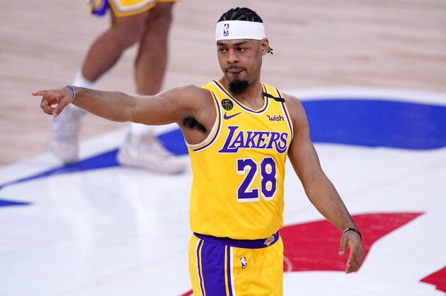 Los Angeles Lakers' Quinn Cook gestures from the court during the second half an NBA conference final playoff basketball game against the Denver Nuggets on Friday, Sept. 18, 2020, in Lake Buena Vista, Fla. (AP Photo/Mark J. Terrill)
