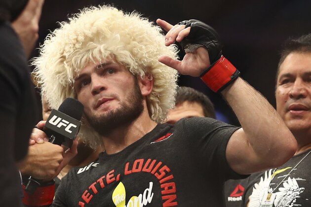 Russian UFC fighter Khabib Nurmagomedov speaks after wining against UFC fighter Dustin Poirier, of Lafayette, La., during Lightweight title mixed martial arts bout at UFC 242, in Yas Mall in Abu Dhabi, United Arab Emirates, Saturday , Sept.7 2019. (AP Photo/ Mahmoud Khaled)
