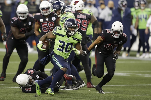 Seattle Seahawks running back Carlos Hyde (30) rushes against the Arizona Cardinals during the first half of an NFL football game, Thursday, Nov. 19, 2020, in Seattle. (AP Photo/Lindsey Wasson)