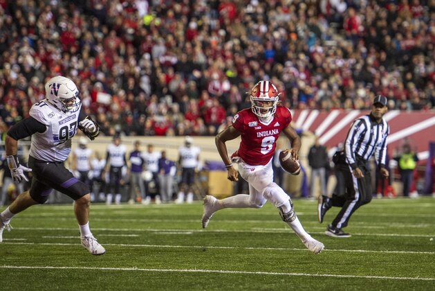 Indiana quarterback Michael Penix Jr. (9) scrambles in the backfield during an NCAA college football game, against Northwestern, Saturday, Nov. 2, 2019, in Bloomington, Ind. Indiana won 34-3. (AP Photo/Doug McSchooler)