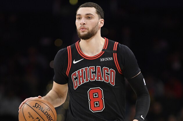 Chicago Bulls guard Zach LaVine (8) dribbles the ball during the first half of an NBA basketball game against the Washington Wizards, Tuesday, Feb. 11, 2020, in Washington. (AP Photo/Nick Wass)
