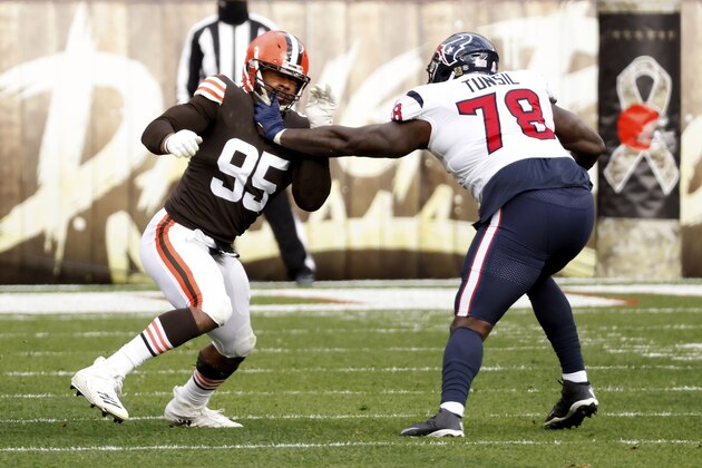 Cleveland Browns defensive end Myles Garrett (95) is blocked by Houston Texans offensive tackle Laremy Tunsil (78) during an NFL football game, Sunday, Nov. 15, 2020, in Cleveland. (AP Photo/Kirk Irwin)