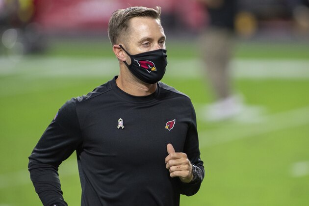 Arizona Cardinals head coach Kliff Kingsbury runs off the field after an NFL football game against the Miami Dolphins, Sunday, Nov. 8, 2020, in Glendale, Ariz. (AP Photo/Jennifer Stewart)