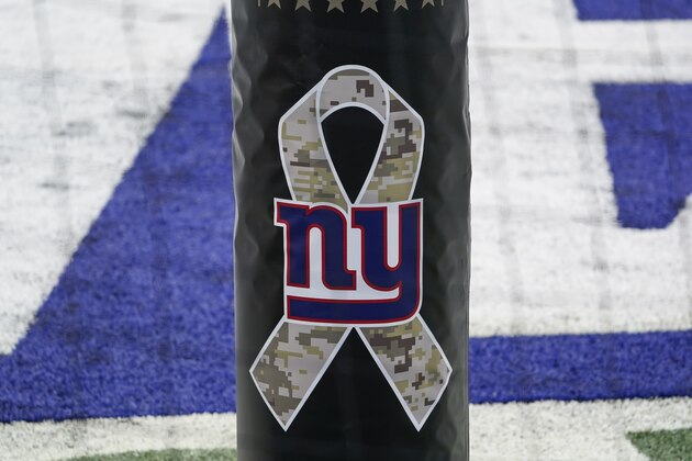 A Salute to Service logo is shown before an NFL football game between the New York Giants and the Philadelphia Eagles Sunday, Nov. 15, 2020, in East Rutherford, N.J. (AP Photo/Seth Wenig)