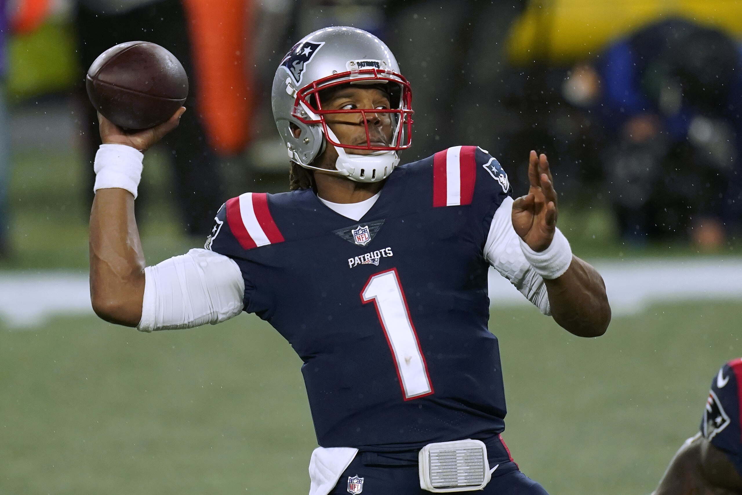 New England Patriots quarterback Cam Newton passes against the Baltimore Ravens in the first half of an NFL football game, Sunday, Nov. 15, 2020, in Foxborough, Mass. (AP Photo/Elise Amendola)