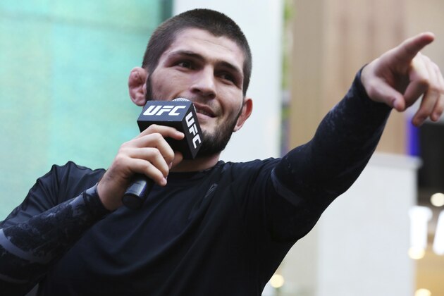 Russian UFC fighter Khabib Nurmagomedov gestures to the crowd during an open training session at Yas Mall in Abu Dhabi, United Arab Emirates, Wednesday, Sept. 4, 2019. Fighters Dustin Poirier and Khabib Nurmagomedov will face each other in UFC 242, which will be held Saturday, Sept. 7, 2019, in Abu Dhabi. Nurmagomedov did not spar during the open training, saying he was still trying to make weight for the bout. (AP Photo/Jon Gambrell)