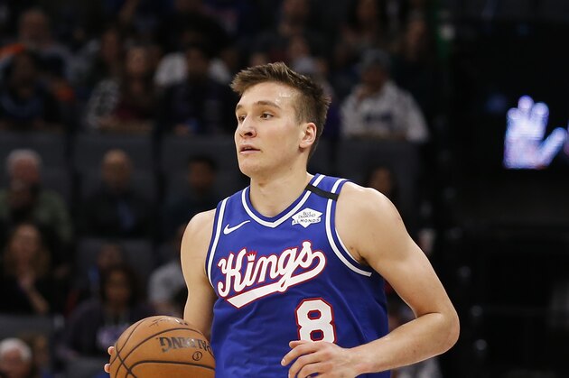 Sacramento Kings guard Bogdan Bogdanovic dribbles down court during the second half of an NBA basketball game against the Philadelphia 76ers in Sacramento, Calif., Thursday, March 5, 2020. The 76ers won 125-108. (AP Photo/Rich Pedroncelli)