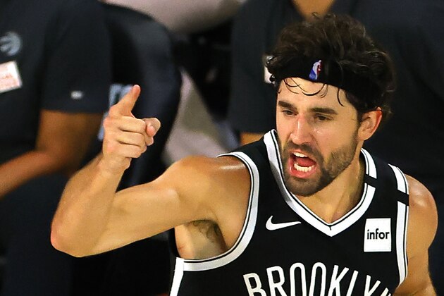 Joe Harris of the Brooklyn Nets reacts after hitting a three point basket against the Toronto Raptors during the fourth quarter of Game 2 of an NBA basketball first-round playoff series, Wednesday, Aug. 19, 2020, in Lake Buena Vista, Fla. (Kevin C. Cox/Pool Photo via AP)