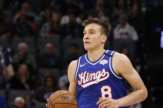 Sacramento Kings guard Bogdan Bogdanovic dribbles down court during the second half of an NBA basketball game against the Philadelphia 76ers in Sacramento, Calif., Thursday, March 5, 2020. The 76ers won 125-108. (AP Photo/Rich Pedroncelli)