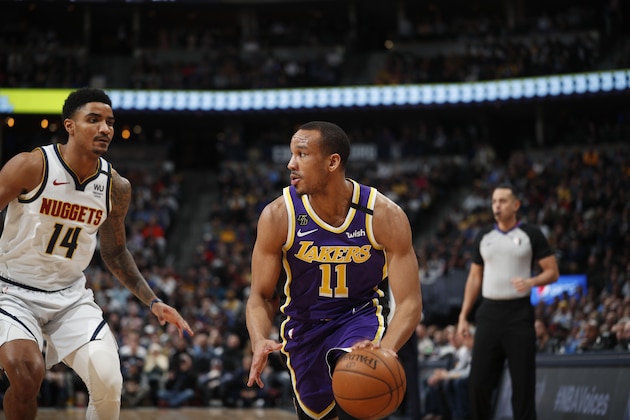 Los Angeles Lakers guard Avery Bradley (11) and Denver Nuggets guard Gary Harris (14) in the first half of an NBA basketball game Wednesday, Feb. 12, 2020, in Denver. (AP Photo/David Zalubowski)