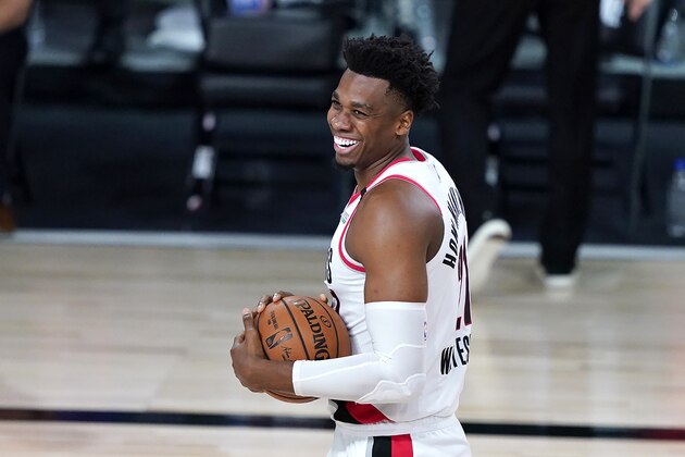 Portland Trail Blazers' Hassan Whiteside reacts after missing a wide-open dunk after being fouled by the Brooklyn Nets during the first half of an NBA basketball game Thursday, Aug. 13, 2020 in Lake Buena Vista, Fla. (AP Photo/Ashley Landis, Pool)