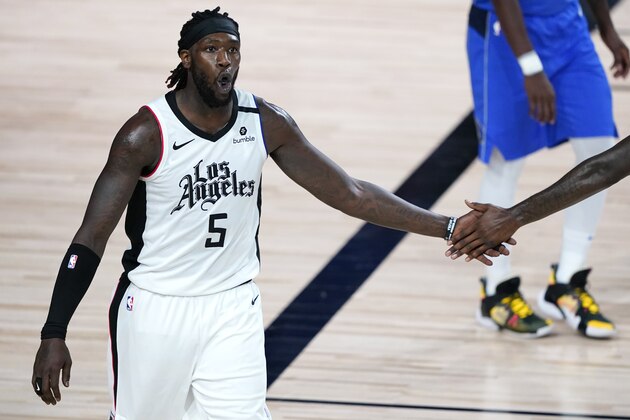 Los Angeles Clippers' Montrezl Harrell (5) celebrates after a basket during the second half of an NBA basketball first round playoff game against the Dallas Mavericks,Tuesday, Aug. 25, 2020, in Lake Buena Vista, Fla. (AP Photo/Ashley Landis, Pool)